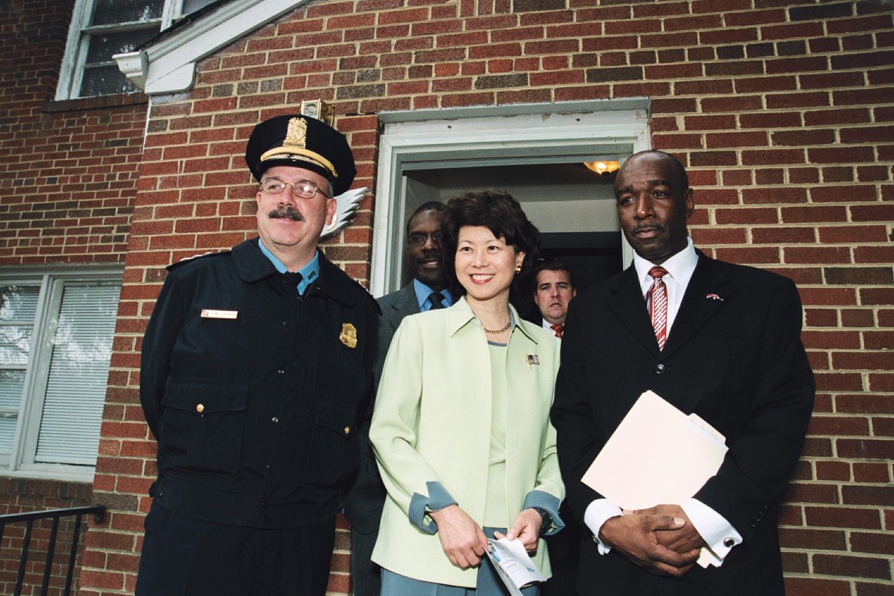 Secretary Elaine Chao celebrating the partnership between faith-based and community organizations and D. C. law enforcement to help ex-offenders gain employment and re-integrate into their communities.  