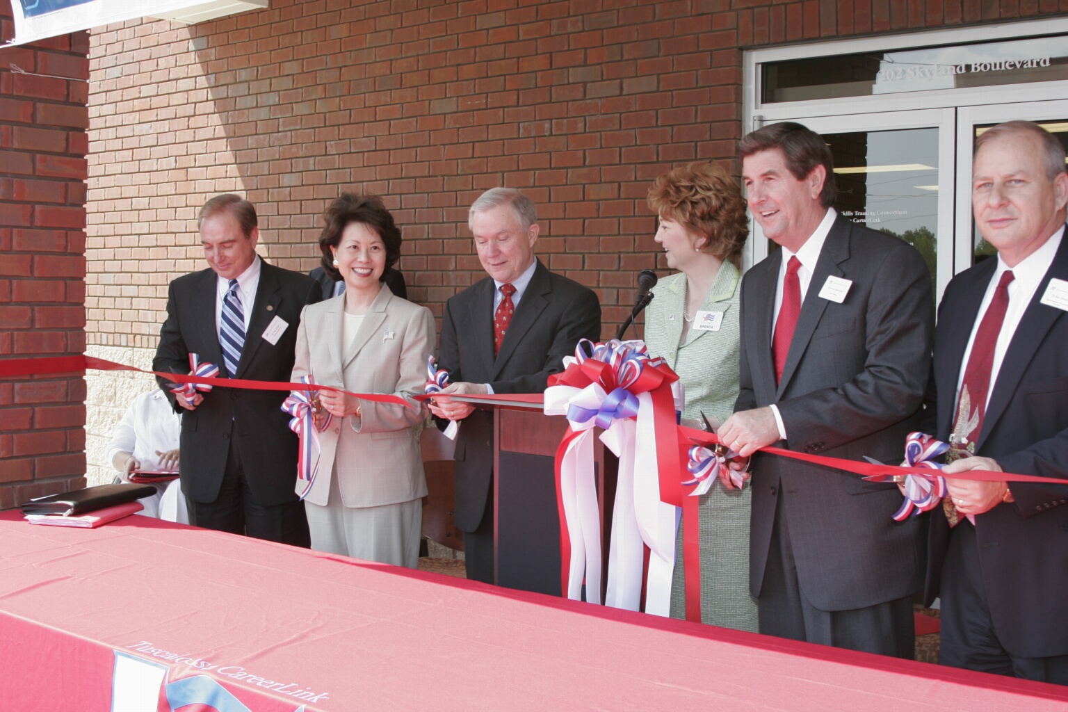 Secretary Elaine Chao opening a new one-stop career center in Tuscaloosa, Alabama with U. S. Senator Jeff Sessions and Governor Bob Riley attending.