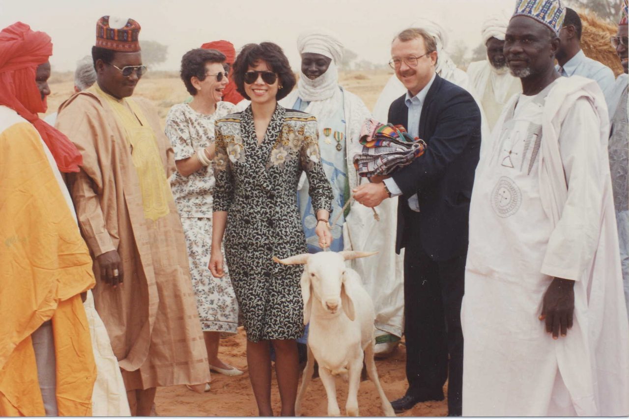 Peace Corps Director Elaine Chao presented with a goat by village elders upon her arrival in Niger. 