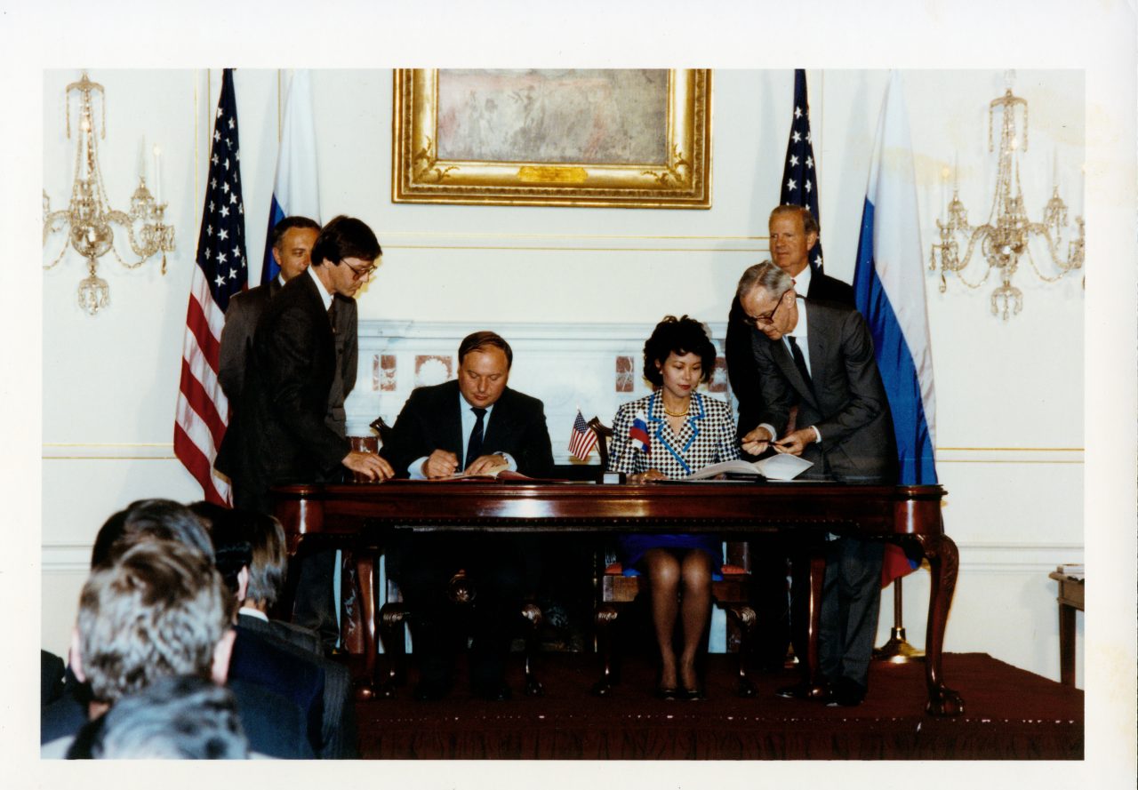 Peace Corps Director Elaine Chao signing the Peace Corps country agreement with Russian Prime Minister Yegor Gaidar.