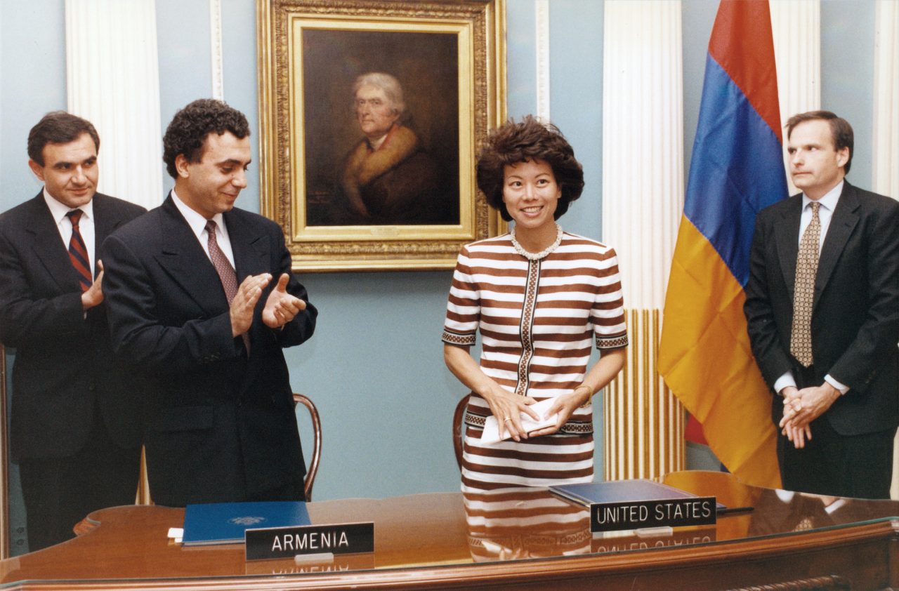 Peace Corps Director Elaine Chao signing the Peace Corps country agreement with Armenian Prime Minister Hrant Bagratyan.