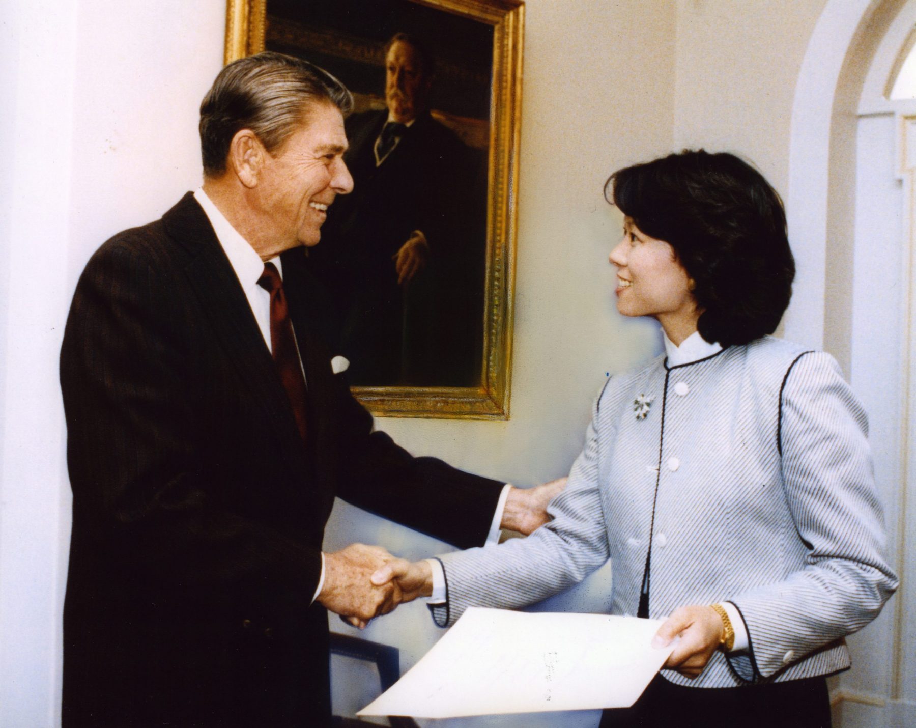 Elaine Chao receiving her White House Fellow certificate from President Ronald Reagan in the Cabinet Room of the White House, where years later, Elaine would attend cabinet meetings as the Secretary of Labor & then, as Secretary of Transportation.